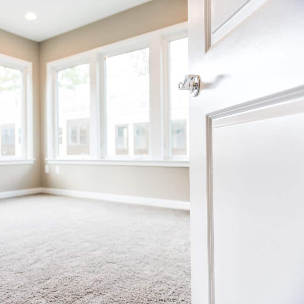 Bedroom with newly installed carpet